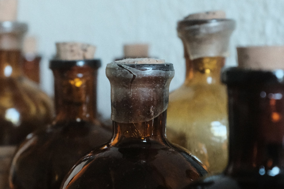 A group of brown bottles sitting on top of a table